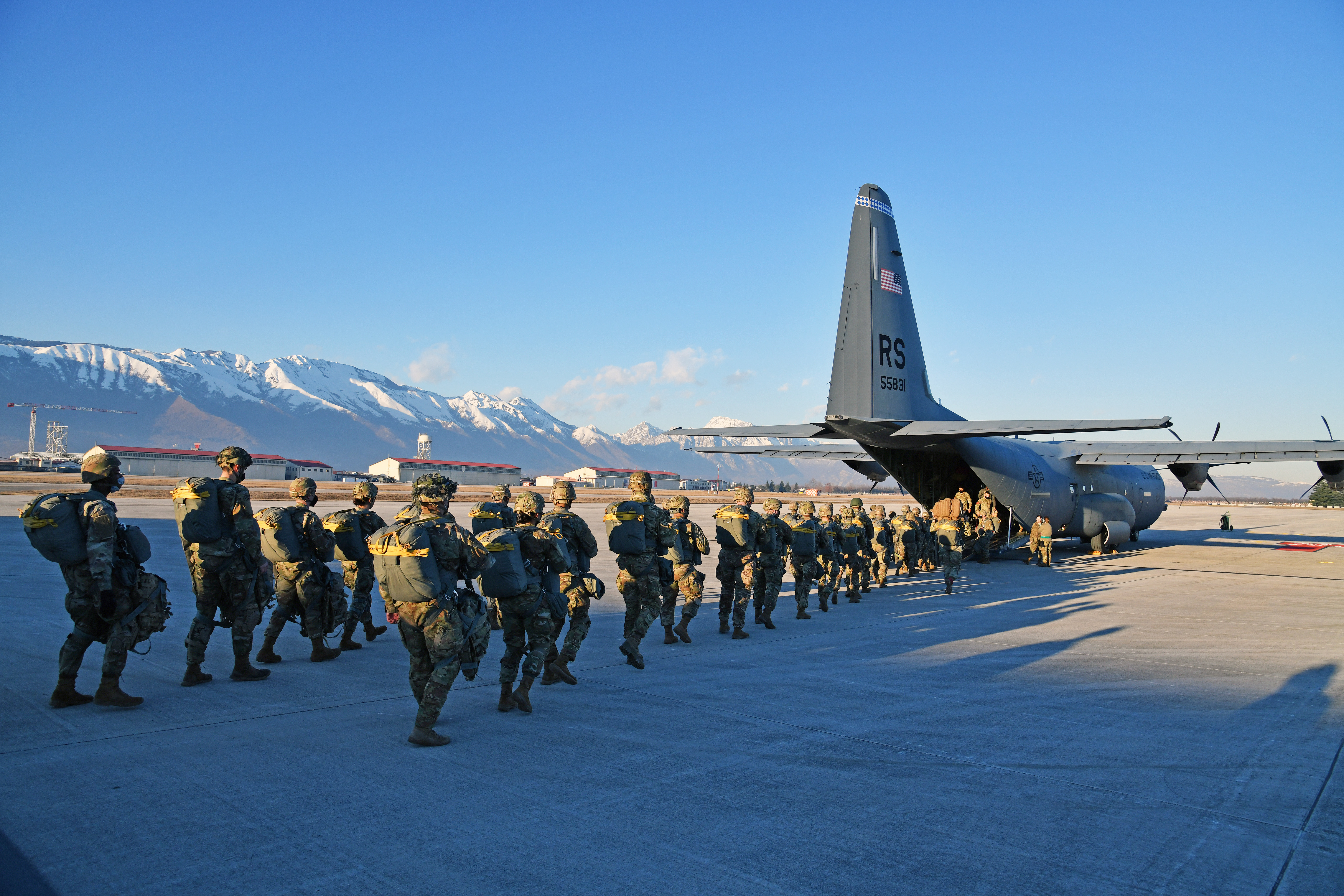 U.S. paratroopers jump from a C-130 Hercules aircraft over Juliet drop zone  in Pordenone, Italy